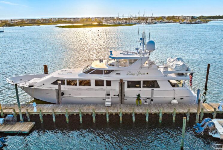 White yacht named Lady Grace docked in a marina